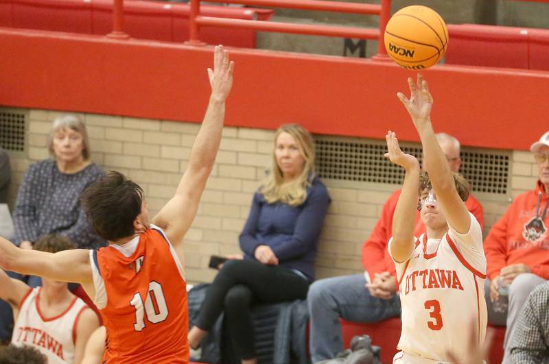 Ottawa's Connor Diederich hits a jump shot over Pontiac's Cam Fenton during the Dean Riley Shootin' The Rock Thanksgiving Tournament on Monday, Nov. 25, 2024 in Kingman Gym at Ottawa High School.