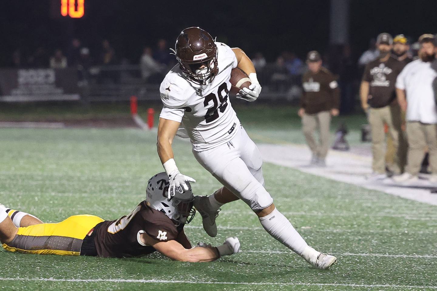 Joliet Catholic’s Nate Magrini sheds a tackle against Mount Carmel on Friday, Oct. 11, 2024 in Chicago.