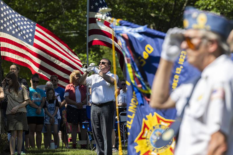 Chris Hammitt plays taps Monday, May 25, 2026, at Oakwood Cemetery, in observance of Memorial Day.