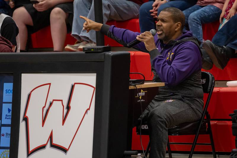 Jamal “The Voice” Thompson of the Harlem Wizards talks into microphone on Wednesday, April 16, 2025 at Woodland High School in Streator.
