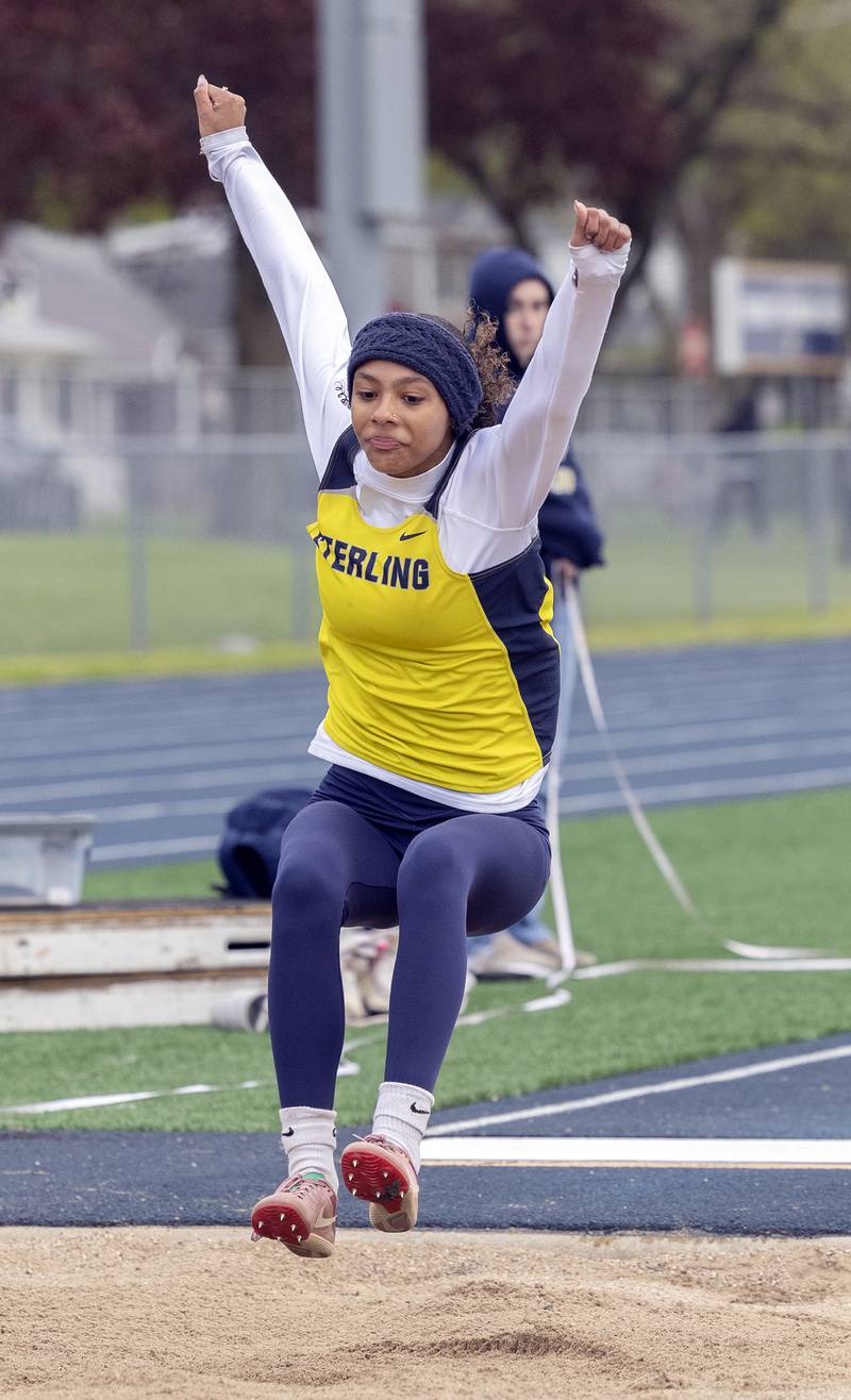 Sterling’s Paizley Johnson lands her triple jump Friday, May 2, 2025, at the Sterling Night Relays.
