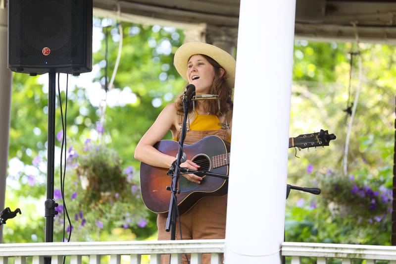 Laney Jones performs on a porch along Western Avenue. The Upper Bluff Historic District hosted Porch & Park Music Fest featuring a variety of musical artist at five different locations. Saturday, July 30, 2022 in Joliet.