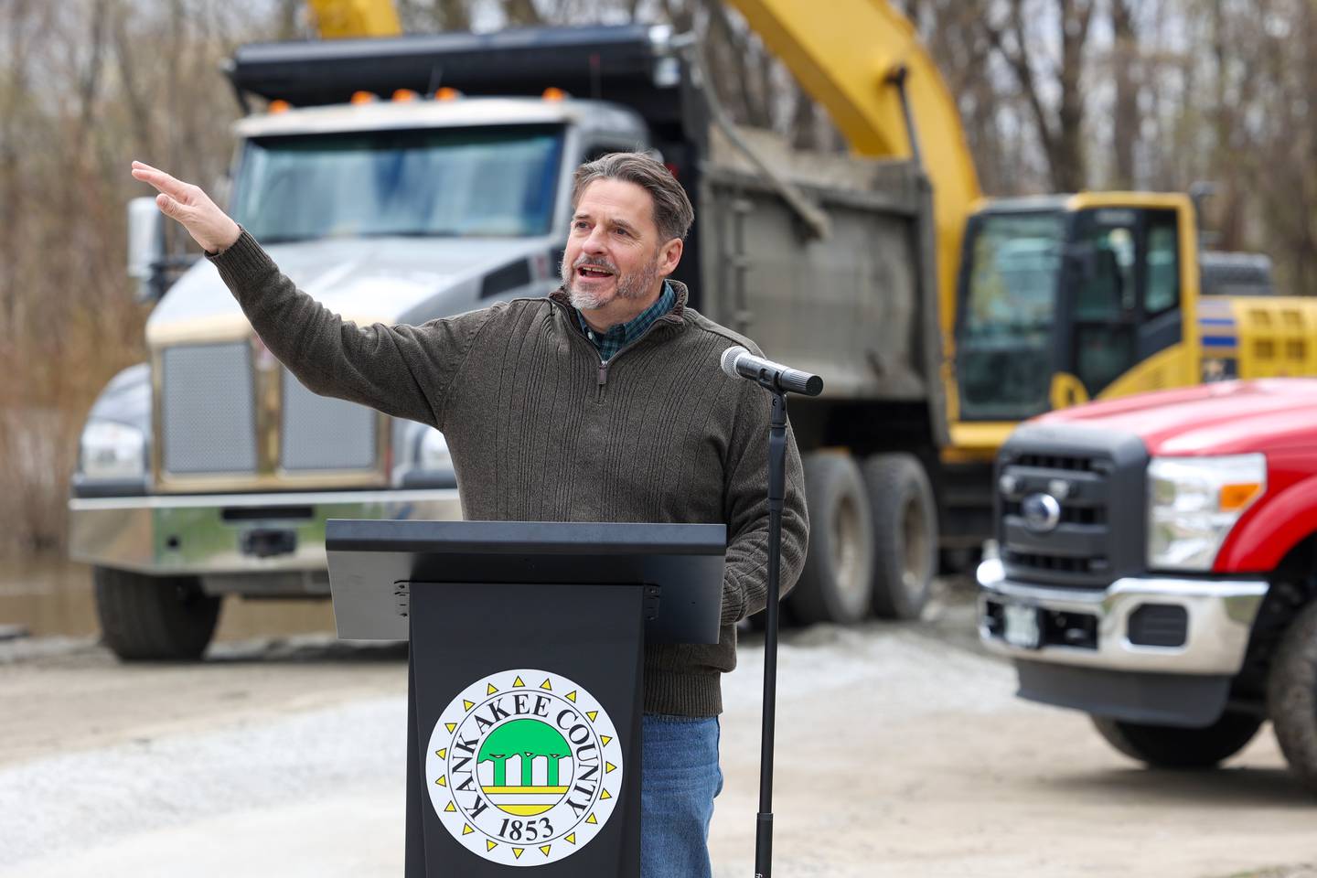 Scott Pelath, executive director of Kankakee River Basin and Yellow River Basin Development Commission in Indiana, speaks at a kick-off event for the Kankakee River sediment removal project at the Aroma Park boat ramp on Tuesday, April 15, 2025.