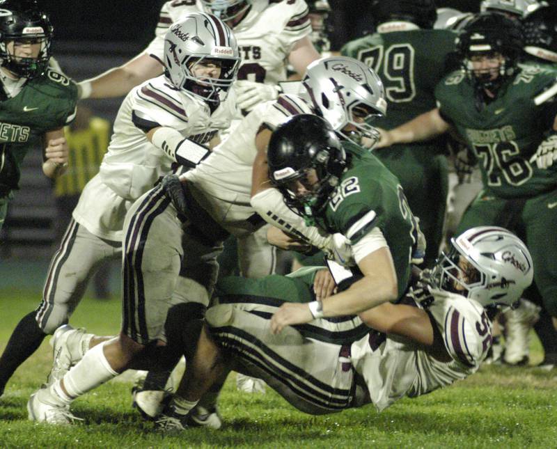 Rocket player  Cooper South is brought down by IVC defenders . The Grey Ghosts of Illinois Valley Central traveled to Hinders Field in Rock Falls on Friday, October 10, 2025 to take on the Rockets.