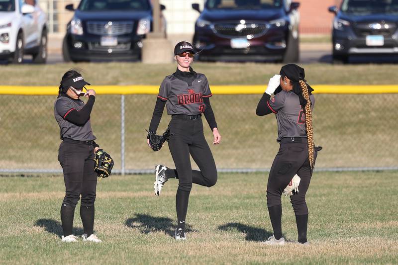 Bolingbrook’s Hannah Jones, center, dances to the music between innings against Plainfield Central on Wednesday, March 20, 2024.