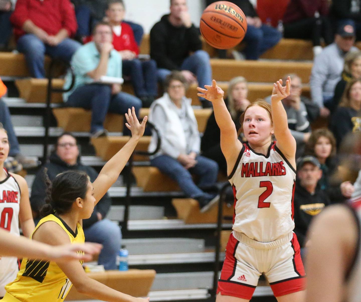 Henry-Senachwine's Brynna Anderson sinks a three-point basket over Putnam County's Valeria Villagomez on Monday, Dec. 18, 2023 in Henry.