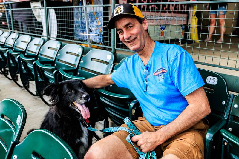 Wheaton resident Matt Sons and Marv enjoy the Joliet Slammers Dog Day event, presented by University of St. Francis, on Aug. 10, 2025.