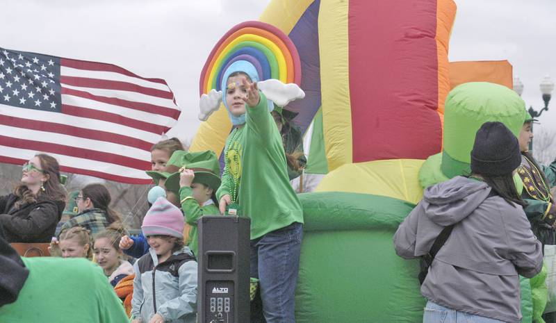Candy is tossed from a float during Dixon's St. Patrick's Day parade on March 15, 2025.