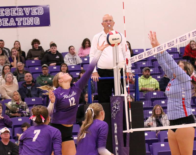 Rochelle's Jillian Bruns (12) flips the ball over the net during a match with Ottawa on Oct. 23, 2025.