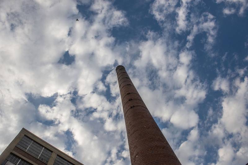 The smokestack at the former National building in Sterling juts up into an October sky. The Sterling Riverfront Commission conducted tours of the old plant.