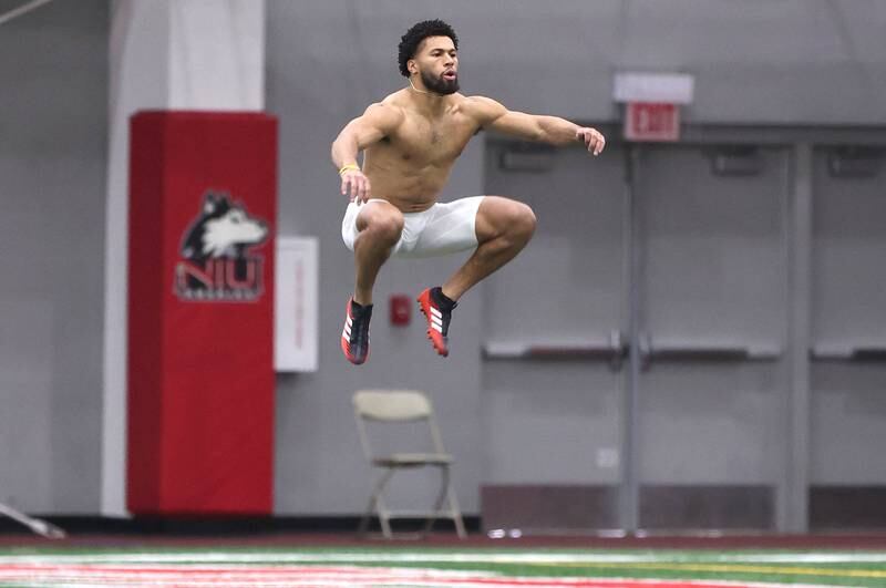 Former Western Illinois University and DeKalb High School receiver Tony Tate does some jumping to get loose before running his 40-yard dash Wednesday, March 30, 2022, during pro day in the Chessick Practice Center at NIU. Several NFL teams had scouts on hand to evaluate the players ahead of the upcoming draft.