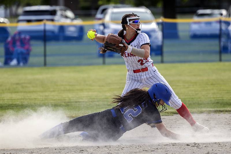Fulton’s Kerby Germann avoids a sliding Anna Propheter of Newman Tuesday, May 19, 2026, at the Class 1A softball regionals at Newman.