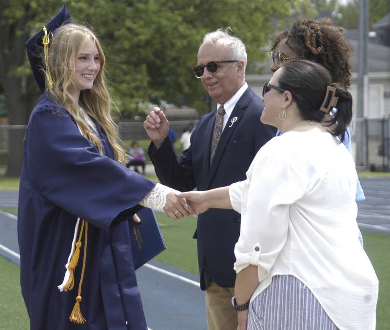 The final SHS grad of the day, Laney Dillion Zuithoff, accepts her diploma Sunday, May 17, 2026, at Roscoe Eades Field in Sterling.