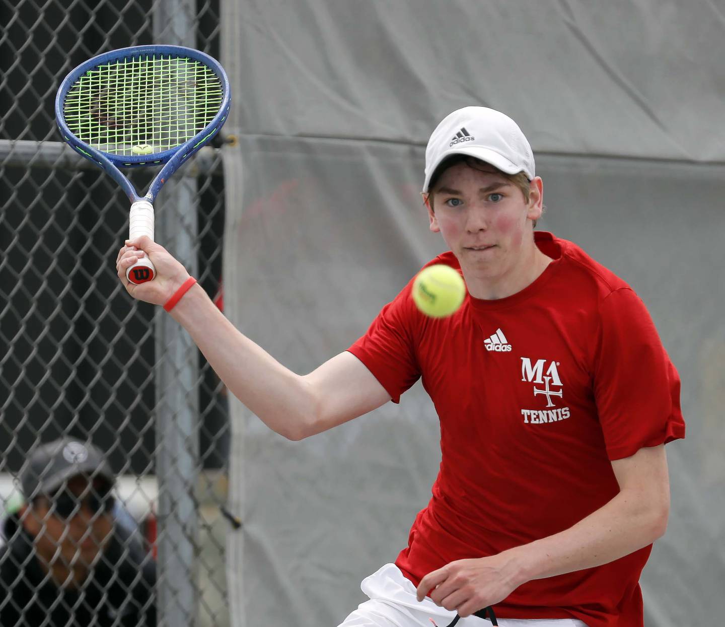 Marmion's Benedict Graft, returns a volley during the IHSA State Tennis Finals Saturday May 27, 2023 in Palatine.