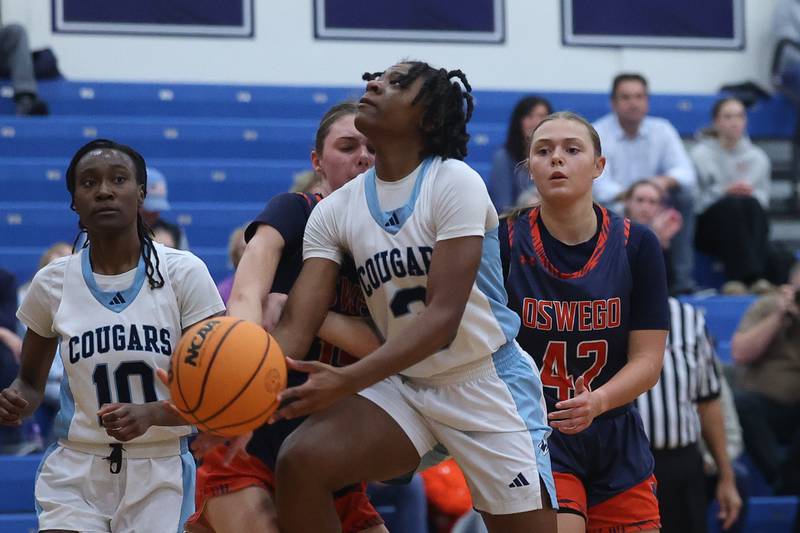 Plainfield South’s Laniya Wills battles for the basket against Oswego on Friday, Jan 17, 2025 in Plainfield.