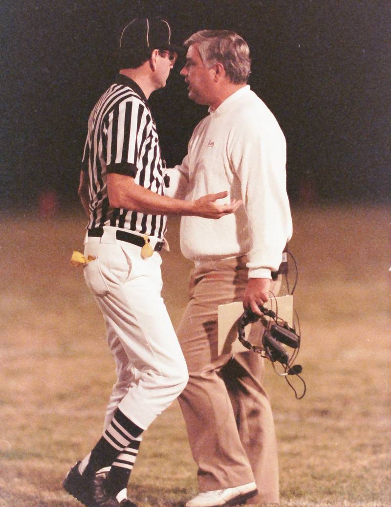 La Salle-Peru head coach Rich Koehler talks with a referee during the game against Ottawa on Friday, Oct. 23, 1992 at King Field in Ottawa.