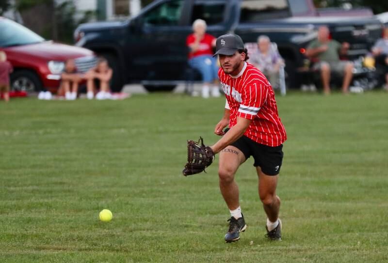 Malden Methodist's Tanner Kuhne tracks down the ball during Princeton Fastpitch Church League championship game Friday night at Westside Park.