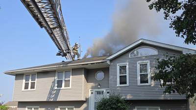 Fire crews battle rapidly spreading porch fire Sunday in Joliet