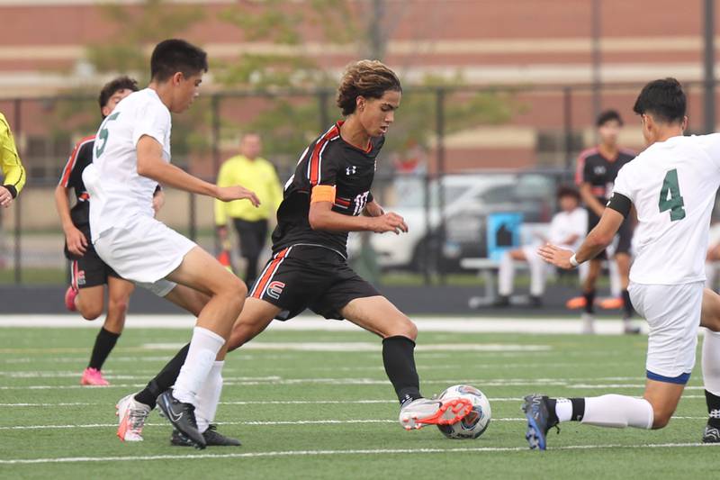Plainfield East’s Yandel Reyes works the ball against Plainfield Central on Tuesday, Sept. 19, in Plainfield.