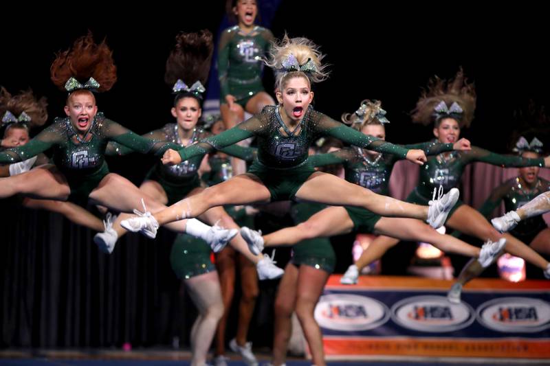 Members of the Grayslake Central cheerleading team compete in the medium team division of the IHSA State Finals on Saturday, Feb. 8, 2025 at Grossinger Motors Arena in Bloomington.