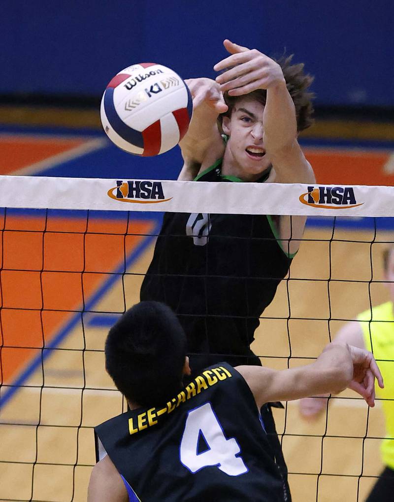 Glenbard West's Charlie Clifford (18) pushes the ball past Glenbard West's Andrew Ellis (4) during the IHSA Boys Volleyball State Quarterfinals Friday May 31, 2024 in Hoffman Estates.
