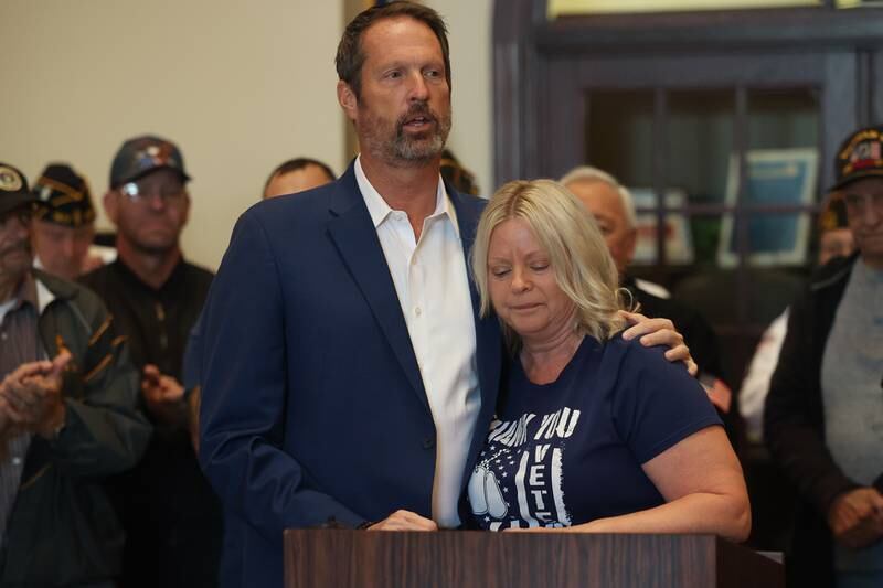 New Lenox Mayor Tim Baldermann recognizes Cathy Welch of the American Legion Post 1977 Auxiliary at the Veterans Day event at the New Lenox Village Hall on Monday, Nov. 11, 2024.