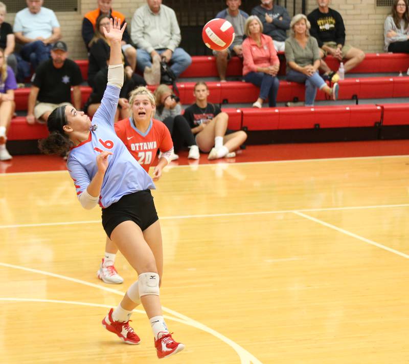 Ottawa's Chey Joachim manages to hit the ball on a return serve from L-P on Thursday, Sept. 21, 2023 at Kingman Gym.