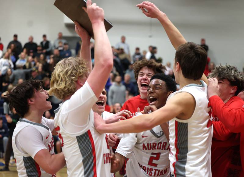 Aurora Christian players celebrate after their win over Hinckley-Big Rock in the sectional final game Friday, March 7, 2025, at Somonauk High School.