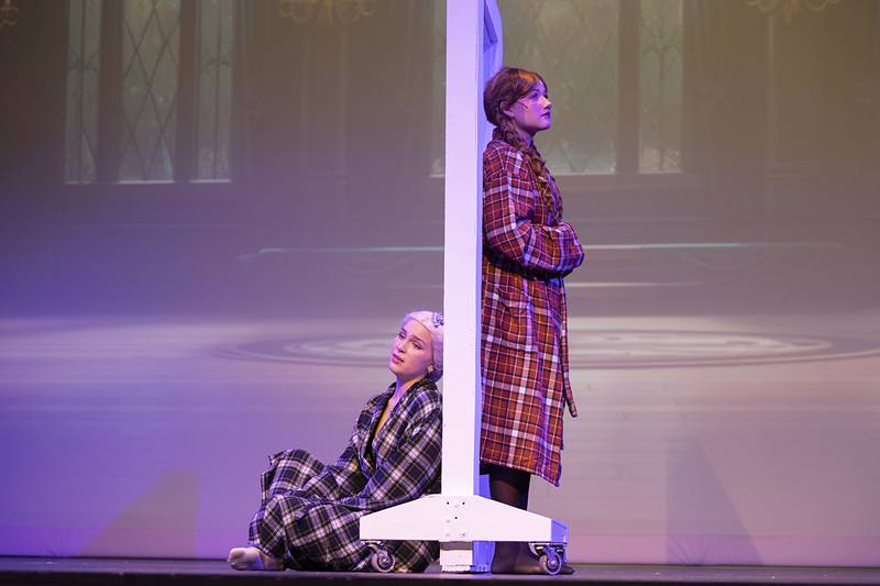 Elsa (left), played by Elise Vander Bleek, and Ana, played by Jess Ardis, rehearse a scene Wednesday, April 15, 2026, for Newman High School’s rendition of “Frozen.”