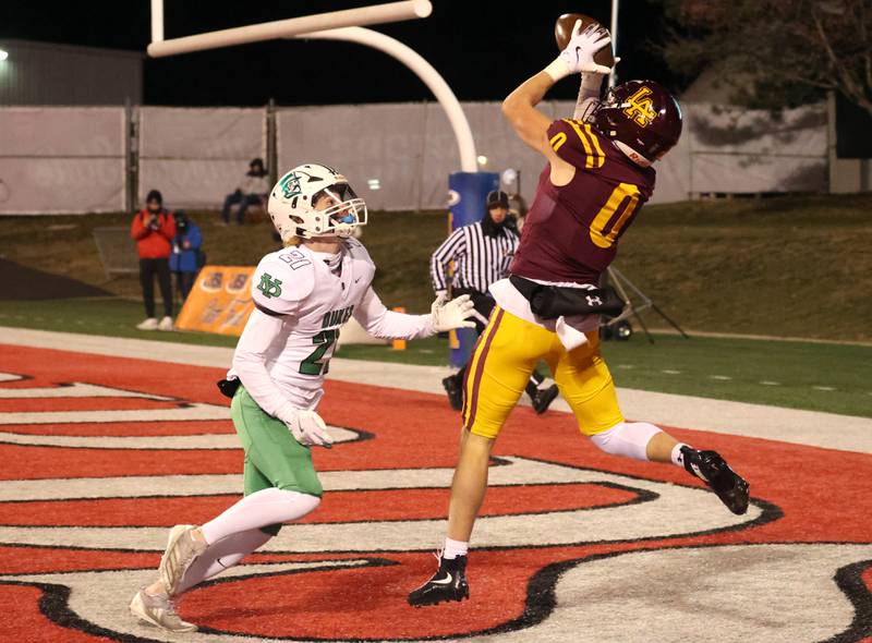 Loyola Academy's Will Carlson catches a touchdown pass in front of York’s Drew Richardson during their Class 8A state championship game Saturday, Nov. 30, 2024, in Hancock Stadium at Illinois State University in Normal.