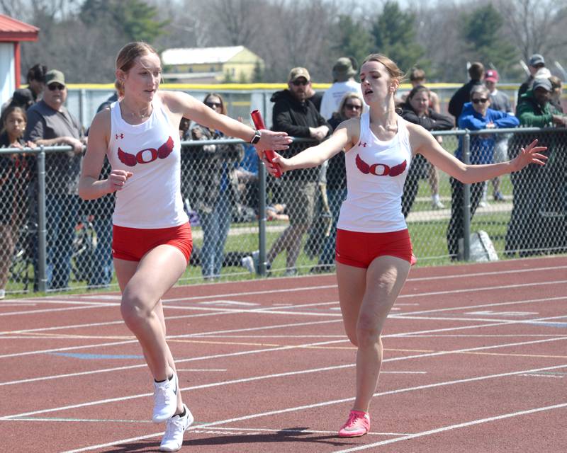 Oregon's Daleanah Koertner hands the baton to Taylor Weems in one of the legs of 4x200 relay at the Gebhardt-Worley Invitational at Oregon High School on Saturday, April 12, 2025. Oregon finished fourth in the event.
