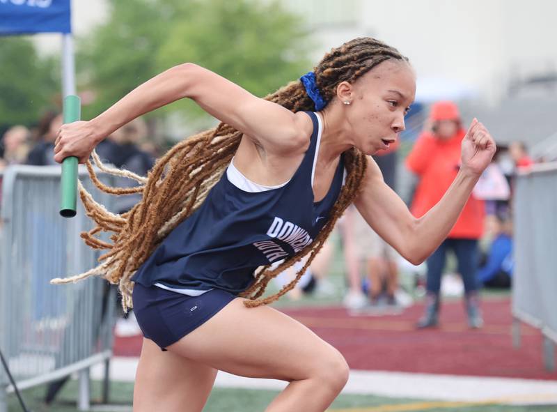 Downers Grove South's Jessica Lander takes off on the first leg of the 4 X 100 relay during the girls varsity track and field 3A Lockport sectional on Friday, May 12, 2023.