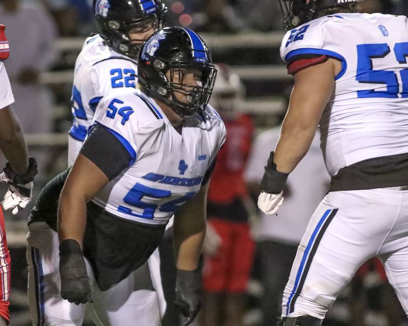 St. Francis's Jaylen Torres (54) celebrates a sack during football game between St. Francis at Kenwood Academy on Thursday, Aug 28, 2025  in Chicago.