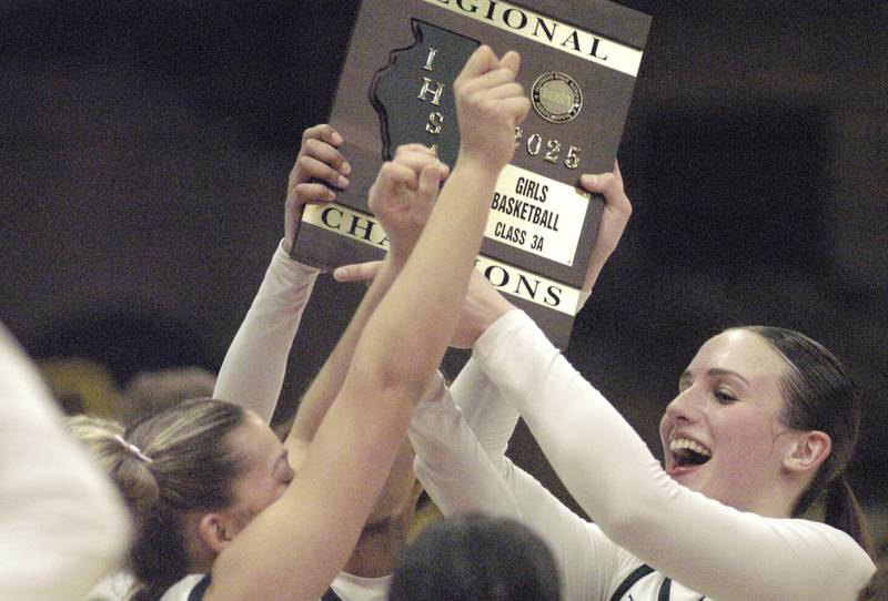 Sterling girls hoist the plaque. The Sterling Golden Warriors faced off against Plano Lady Reapers in an IHSA 3A Regional girls final at Musgrove Fieldhouse in Sterling on February 20, 2025. Sterling won the game 70-38.