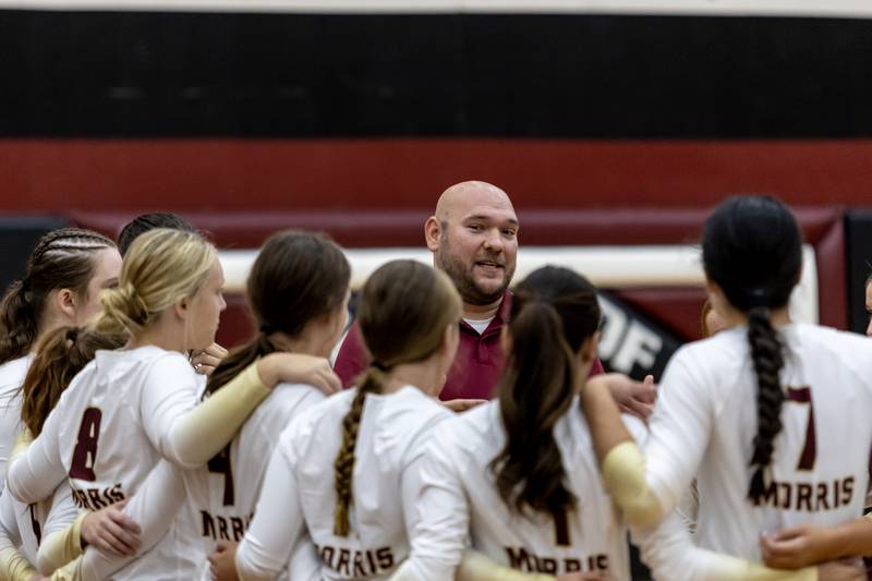 Morris’s varsity volleyball head coach Scott Howell talks to the team during a timeout during a varsity volleyball away game against Plainfield North on Sept. 2, 2025.