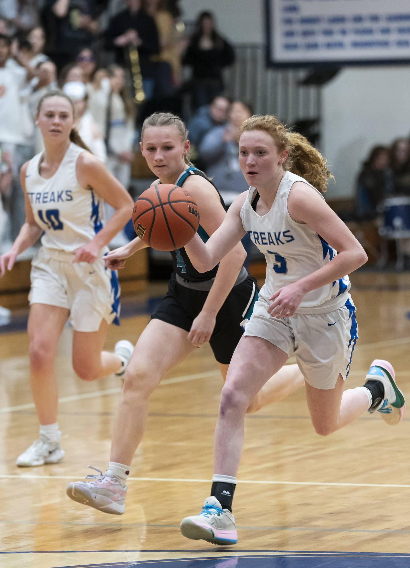 Woodstock's Keira Bogott breaks away from Woodstock North defender Caylin Stevens during their game on Wednesday, February 7, 2024 at Woodstock High School. Ryan Rayburn for Shaw Local