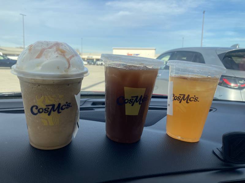 Small CosMc's beverages. From left to right Churro Frappe with Caramel Drizzle, Sweet Tea with Peach Syrup, and Sour Tango Lemonade.