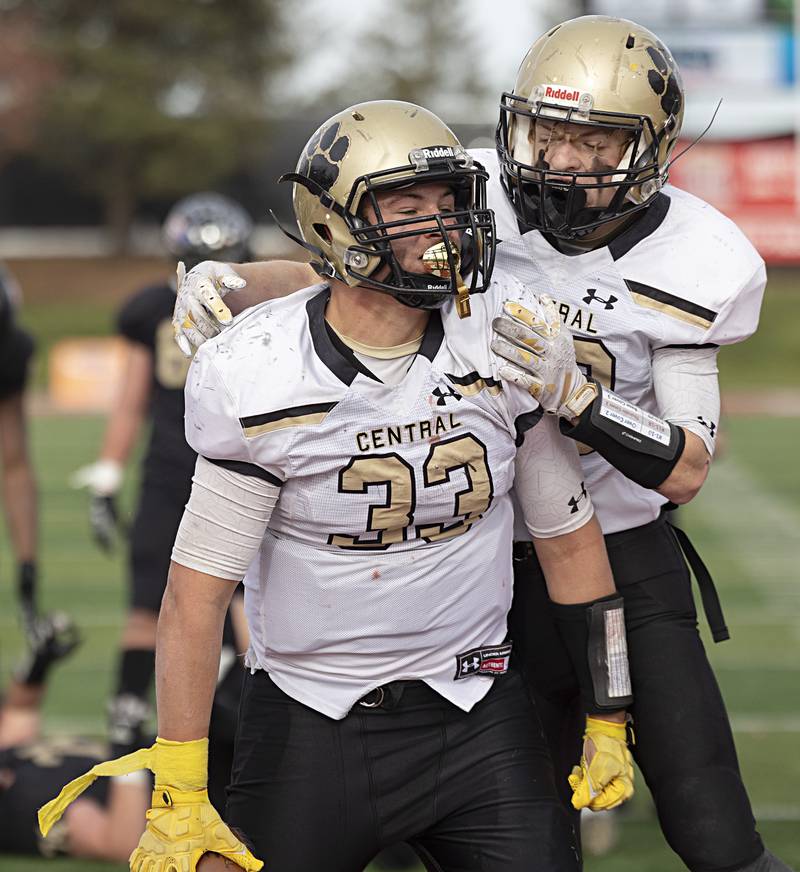 Camp Point's Elijah Genenbacher and Drew Paben celebrate a late game TD against Lena-Winslow Friday, Nov. 24, 2023 in the 1A state football championship game at Hancock Stadium in Normal.