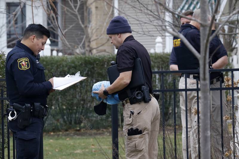 Police investigate at the residence of 408 La Fox River Drive on Wednesday, Dec. 1, 2021, in Algonquin. The bodies of a man and a woman were found about noon Wednesday after a well-being check on La Fox River Drive the day before, according to Algonquin police.