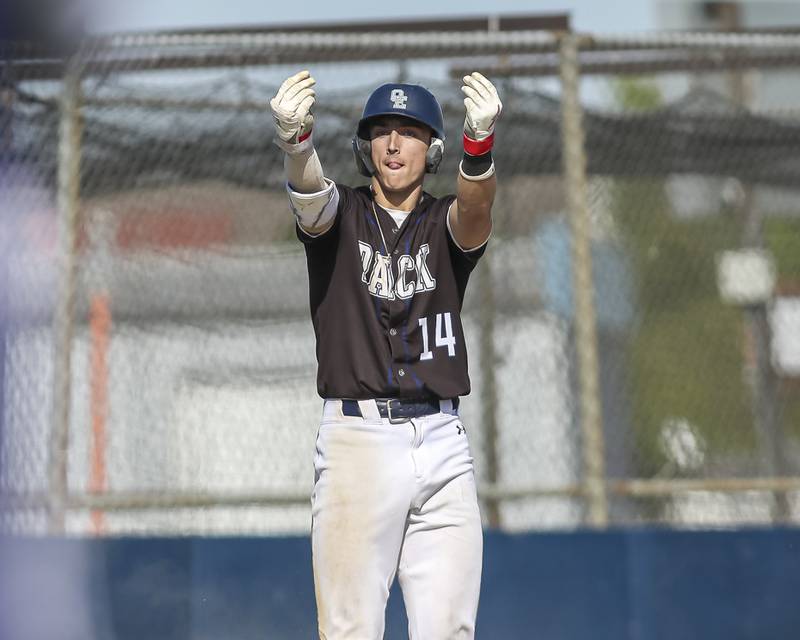 Oswego East's Dominic Battista (14) reacts after hitting a triple during baseball game Oswego East at Oswego.  May 14, 2026 in Oswego.