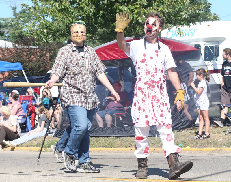 Nightmare on Fairgrounds Road characters wave to people during the 52nd annual Homestead Festival parade on Saturday, Sept. 9, 2023 in Princeton.