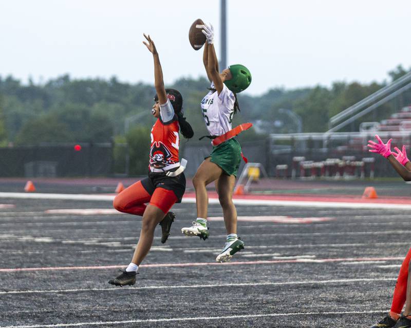 Plainfield Central's Shania Davison (25) goes for the interception during flag football game between Plainfield Central at Bolingbrook Wednesday, Sept 3, 2025  in Bolingbrook.