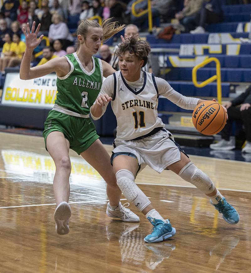 Sterling’s Joslynn James drives to the hoop against Alleman’s Lindsey Britton Thursday, Jan. 29, 2026.