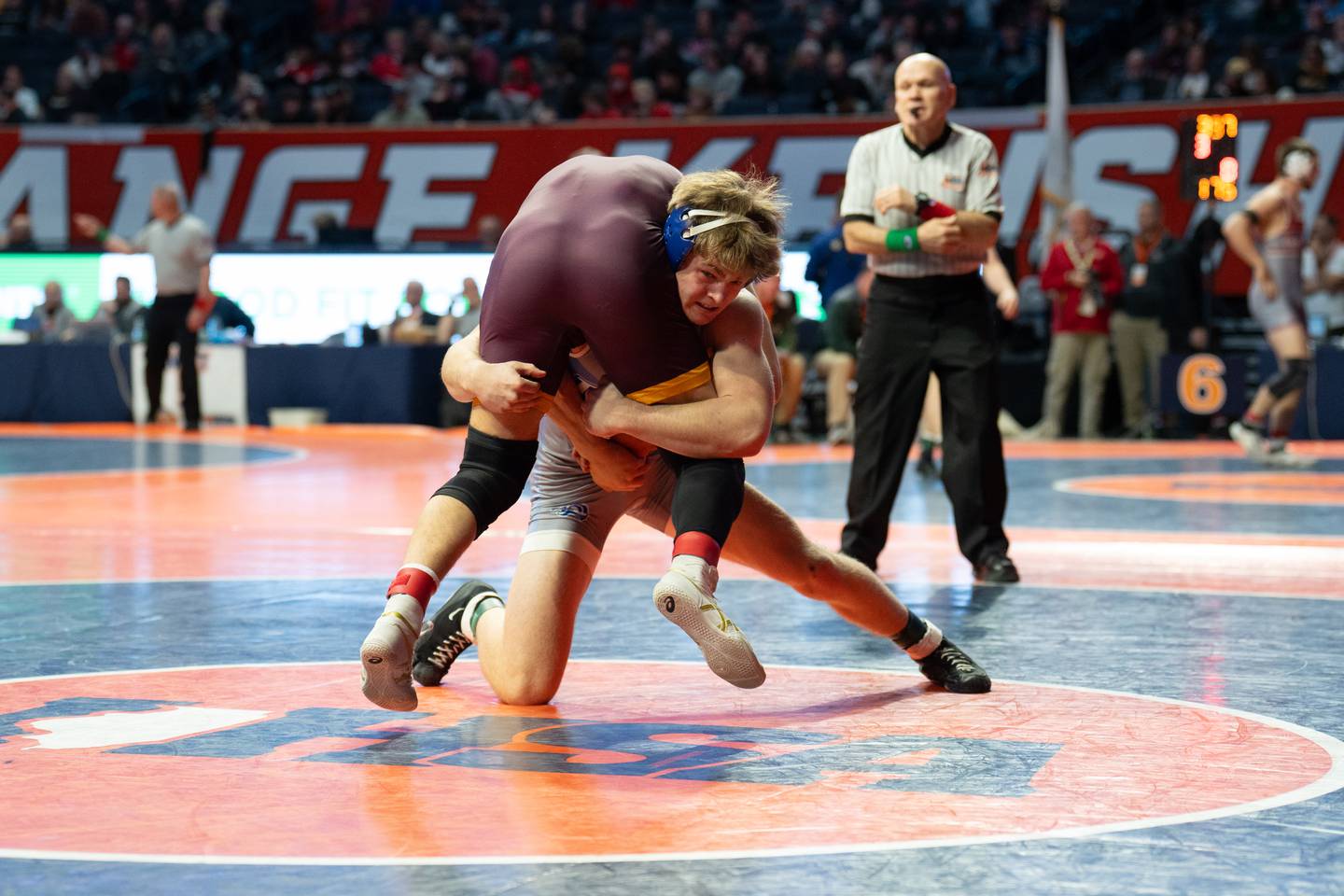 Princeton junior Casey Etheridge (back) wraps up his opponent during the IHSA Class 1A state tournament on Saturday, Feb. 22, 2025 in Champaign.