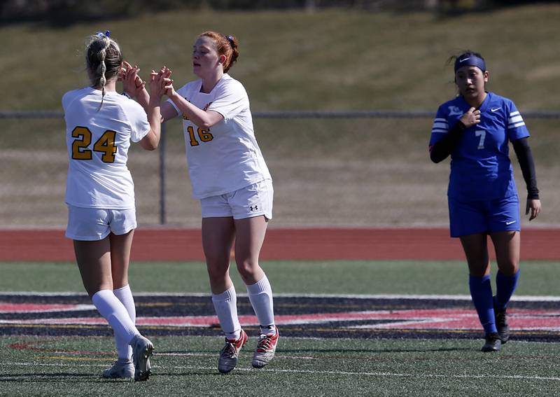 Jacobs' Bella Mickey celebrates with Delaney Lukowski after Lukowski scored a goal during a nonconference Huntley Invite girls soccer match against Larkin Tuesday, March 28, 2023, at Huntley High School.
