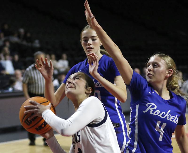 Cary-Grove's Samantha Skerl shoots the ball in from of Burlington Central's Ainsley Wilson (center) and Ashley Waslo (right) during a Fox Valley Conference basketball game  on Tuesday, Jan. 14, 2025, at Now Arena in Hoffman Estates.