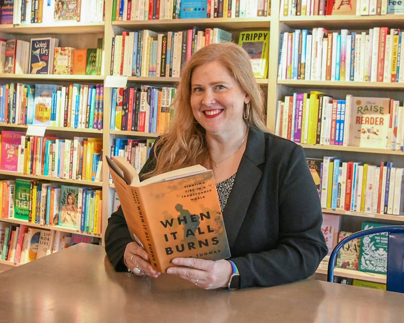 Jen Hall poses for a photo on Friday Oct. 3, 2025, at the Harvey’s Tales bookstore in Geneva.