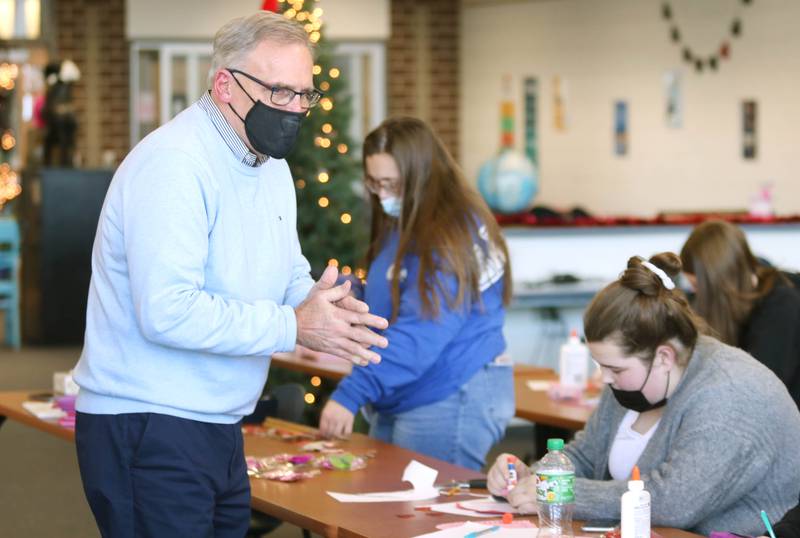 State Senator Dave Syverson R-Rockford talks to students at Genoa-Kingston High School as they make Valentines Day cards Tuesday, Jan. 25, 2022, in the library at the school. The cards will be part of “Valentines for Seniors,” a card drive for local seniors living in residential care facilities, sponsored by Syverson and State Representative Jeff Keicher, R-Sycamore.