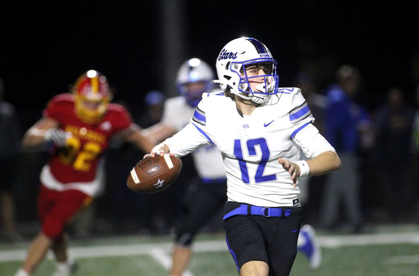 St. Charles North quarterback Will Vaske looks to throw the ball in the third quarter during a game at Batavia on Friday, Oct. 21, 2022.