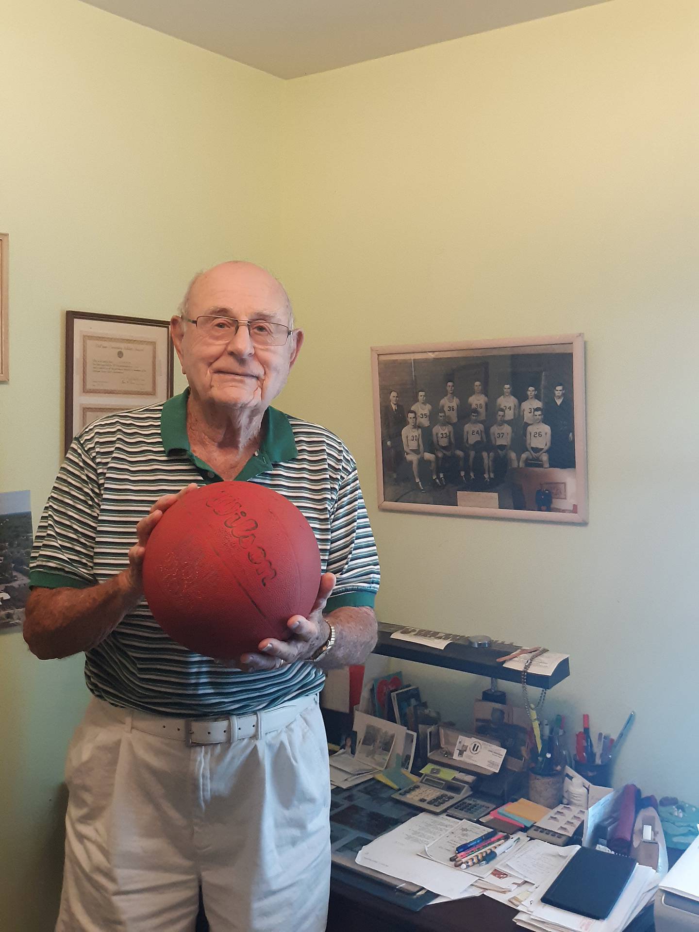 Dick Houston taught world history and driver education at Rock Falls High School from 1958 to 1988. A photo of the 1946-47 RFHS Hall of Fame  boys basketball team, of which he was a part, hangs above his desk at home.